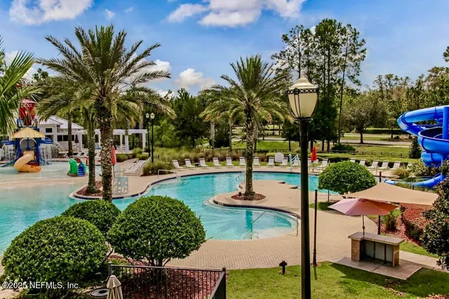 a view of houses with yard