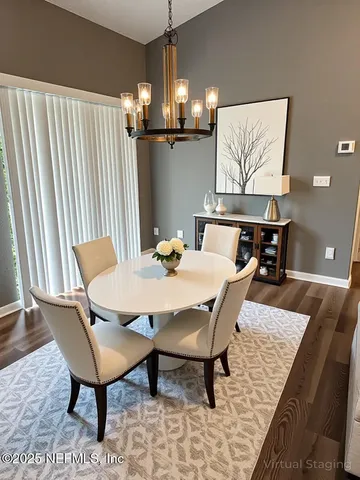 a view of a dining room with furniture