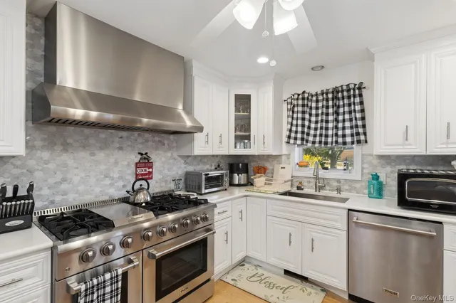 a kitchen with refrigerator cabinets dining table and chairs