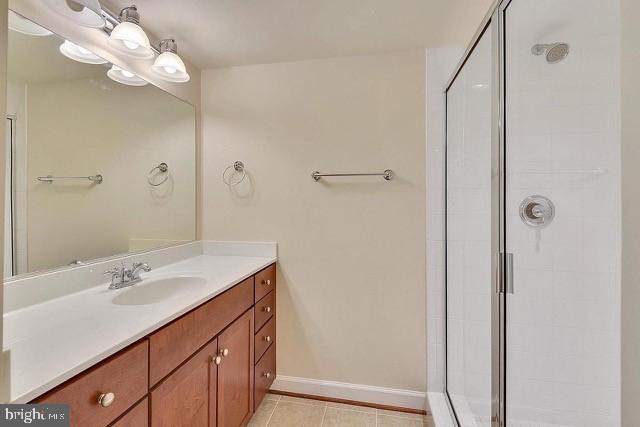 4115 South D S Four Mile Run Drive Arlington, VA 22204 - Photo 7 of 9 a bathroom with a sink a mirror and a shower