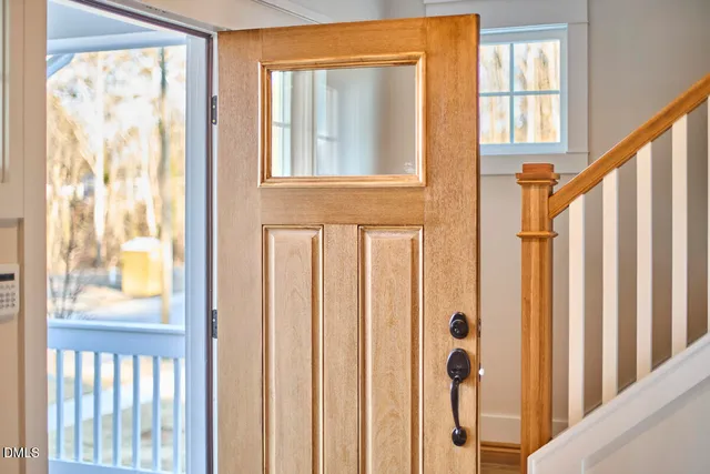 a view of a room with wooden floor