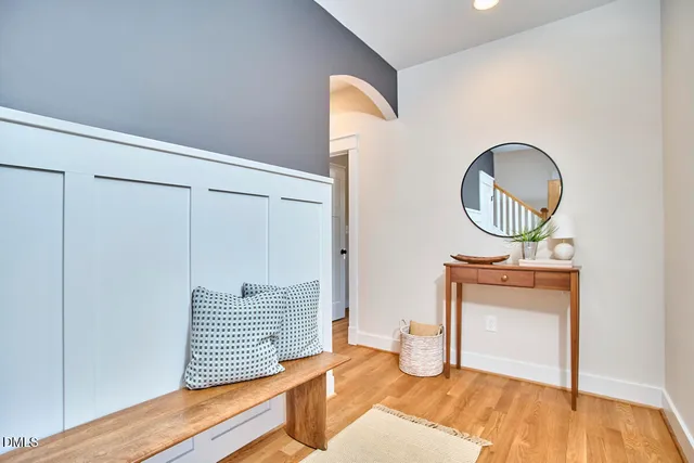 an aerial view of a house with a yard and large trees
