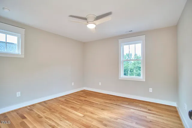 a view of a balcony with wooden floor