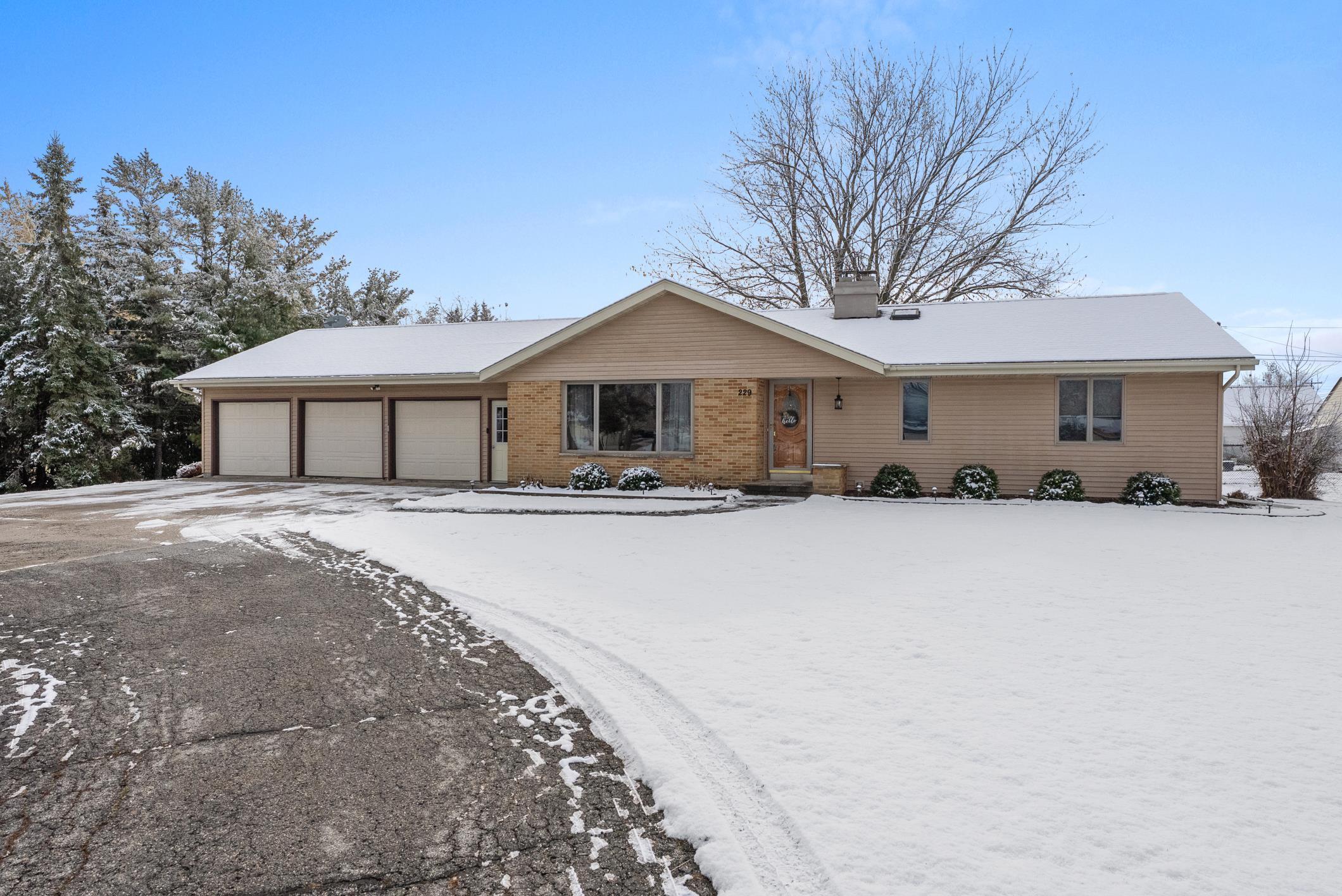 229 Main Street Reedsville, WI 54230 - Photo 1 of 1 34 x 26 garage ATTACHED. 3 openers. Door to back yard.