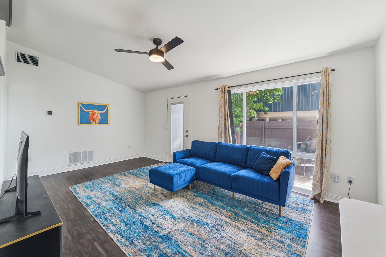 3705 Manorwood Road Austin, TX 78723 - Photo 2 of 13 a living room with furniture and a flat screen tv