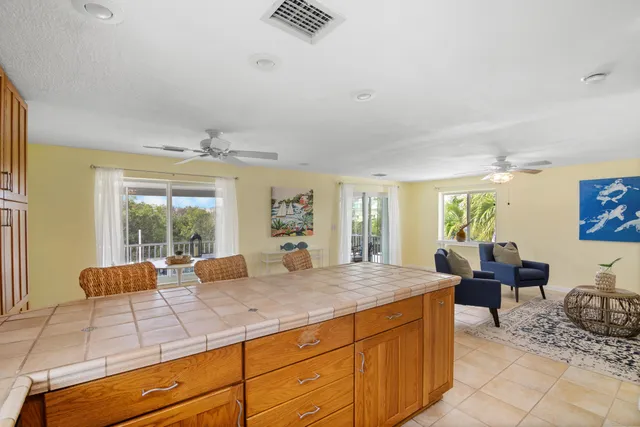 a living room with furniture and large windows