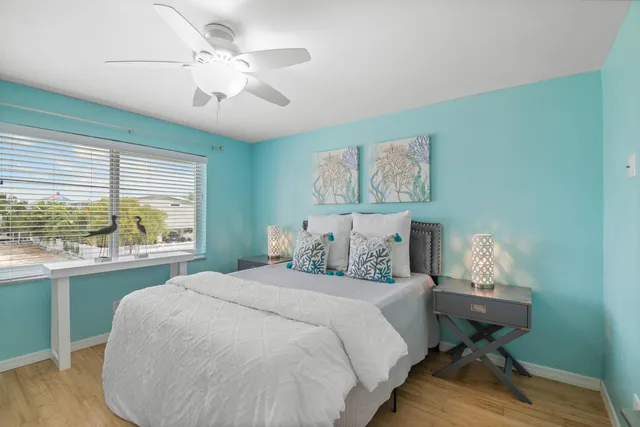 a bedroom with a bed and a table in it