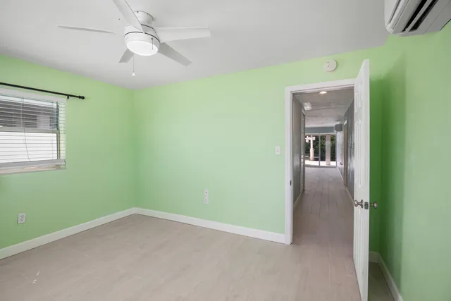 a room with window and pool table