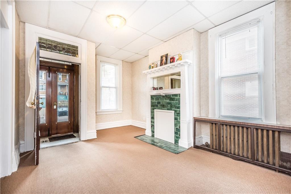 1549 McFarland Road Pittsburgh, PA 15216 - Photo 13 of 25 a view of a hallway with windows