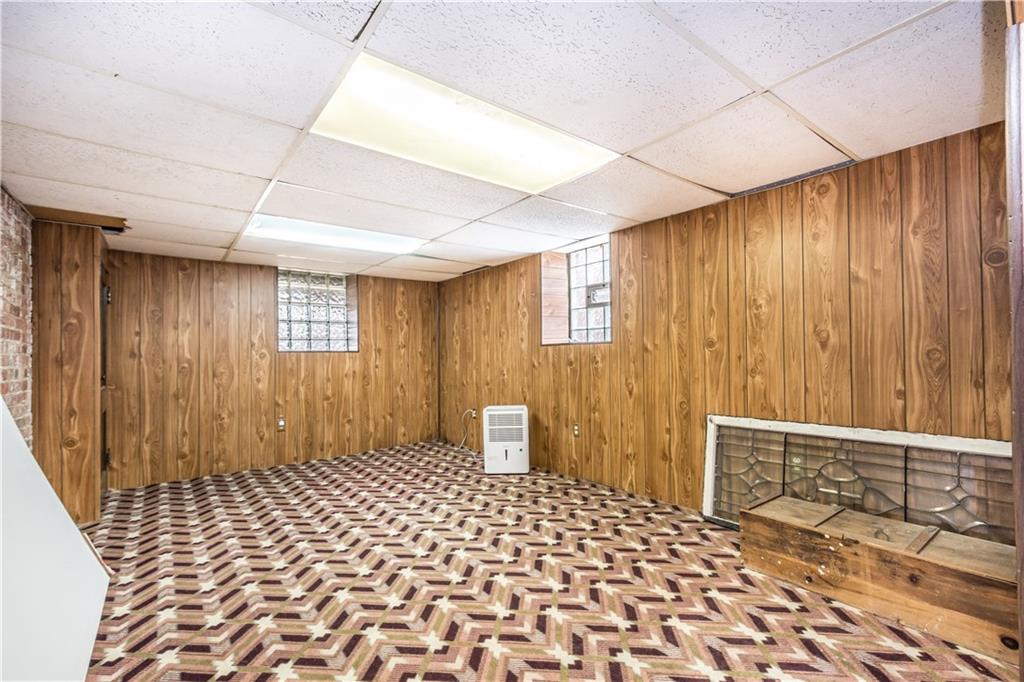 1549 McFarland Road Pittsburgh, PA 15216 - Photo 19 of 25 a bedroom with a bed and a window