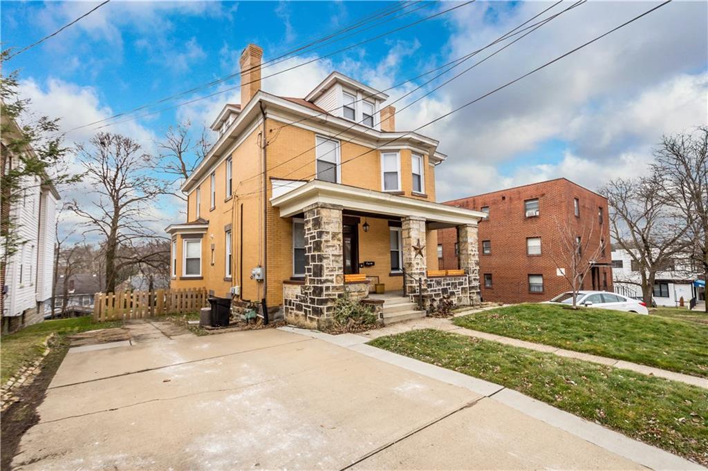 1549 McFarland Road Pittsburgh, PA 15216 - Photo 2 of 25 a front view of a building with sitting area