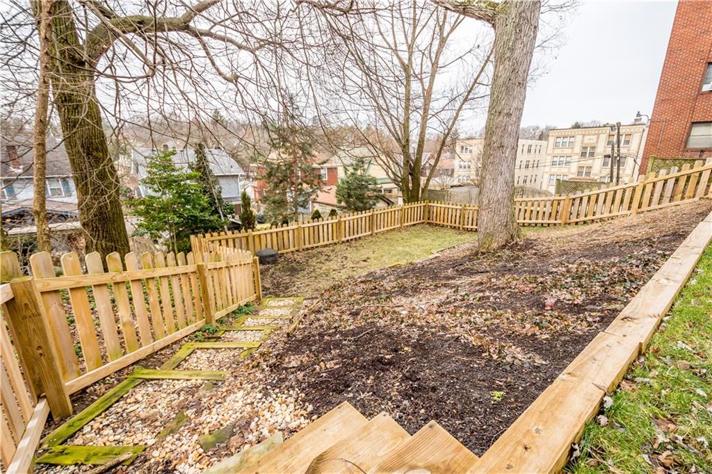 1549 McFarland Road Pittsburgh, PA 15216 - Photo 22 of 25 a view of a pathway of a house with wooden fence