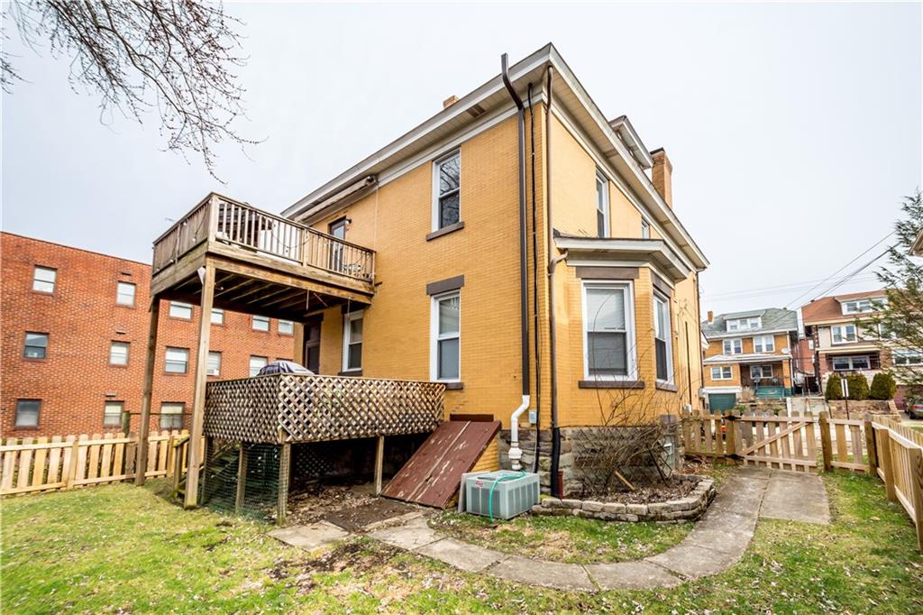 1549 McFarland Road Pittsburgh, PA 15216 - Photo 23 of 25 a view of a house with a yard and sitting area