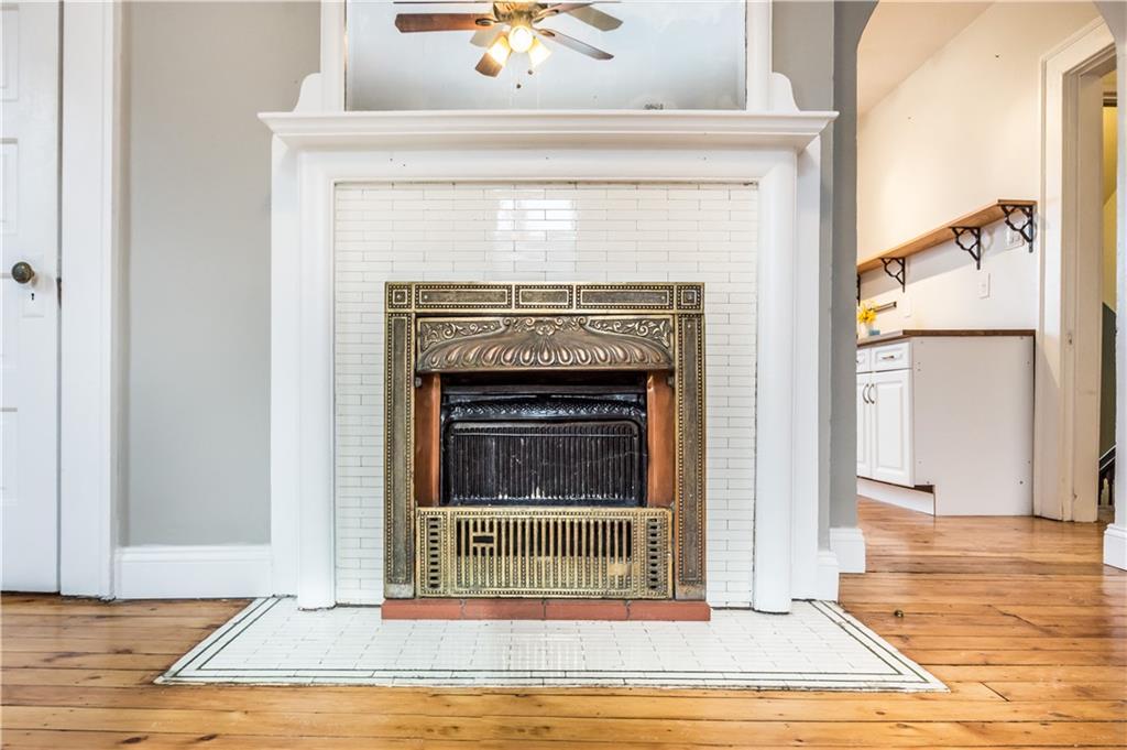 1549 McFarland Road Pittsburgh, PA 15216 - Photo 6 of 25 a view of a livingroom with wooden floor and a fireplace
