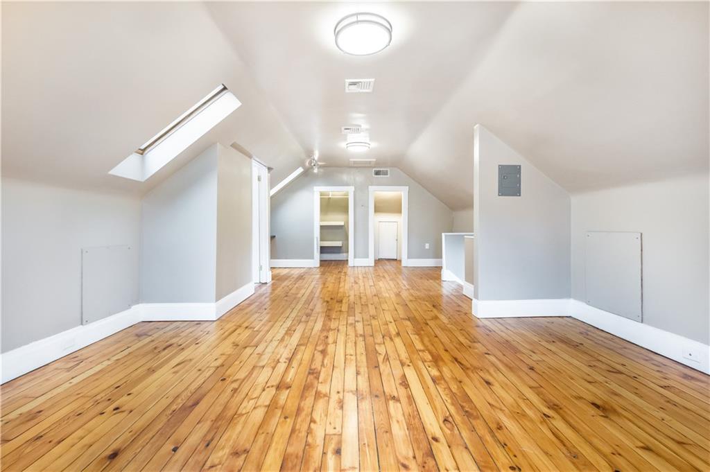 1549 McFarland Road Pittsburgh, PA 15216 - Photo 10 of 25 a view of a big room with wooden floor and windows