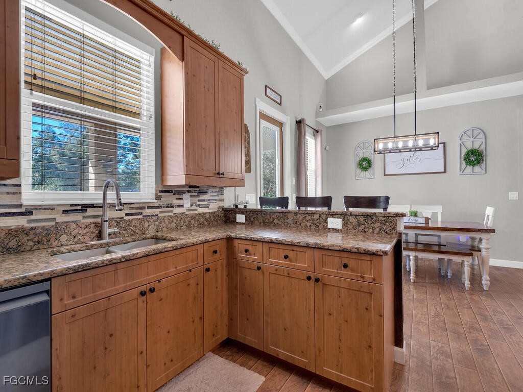 6041 Alan Boulevard Punta Gorda, FL 33982 - Photo 18 of 44 a kitchen with a sink and cabinets