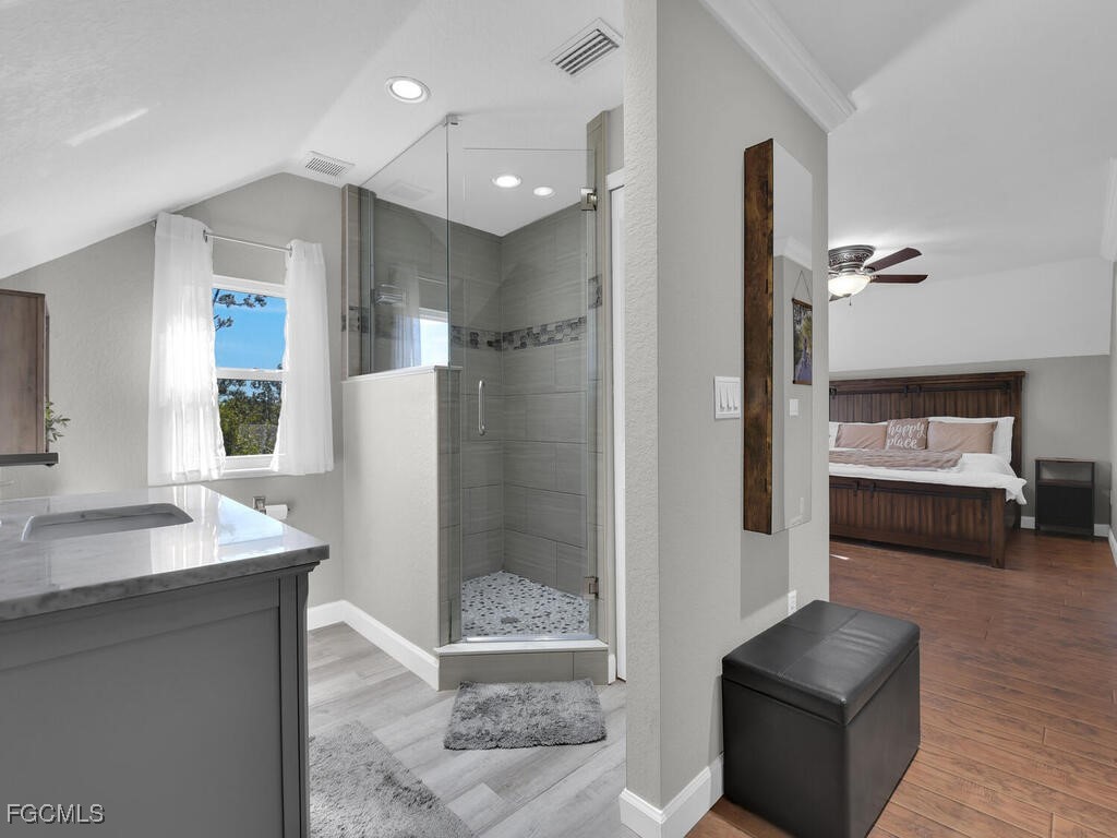 6041 Alan Boulevard Punta Gorda, FL 33982 - Photo 25 of 44 a bathroom with a sink and a mirror