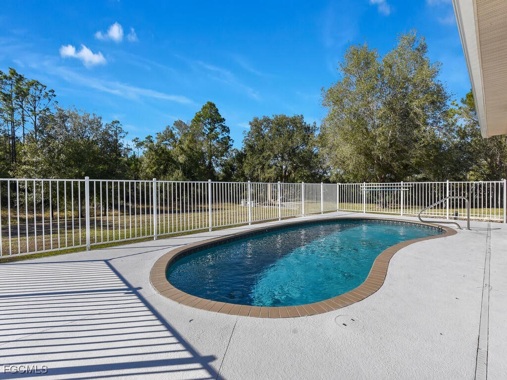 6041 Alan Boulevard Punta Gorda, FL 33982 - Photo 34 of 44 a view of a swimming pool with a patio