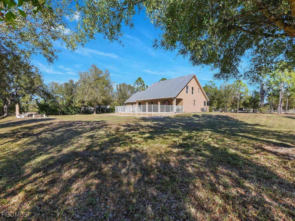 6041 Alan Boulevard Punta Gorda, FL 33982 - Photo 38 of 44 a view of a house with a yard