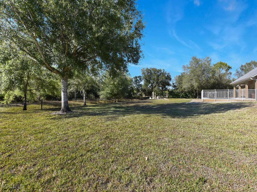 6041 Alan Boulevard Punta Gorda, FL 33982 - Photo 39 of 44 a swimming pool with wooden fence