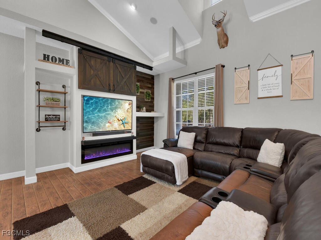 6041 Alan Boulevard Punta Gorda, FL 33982 - Photo 5 of 44 a living room with furniture and a flat screen tv