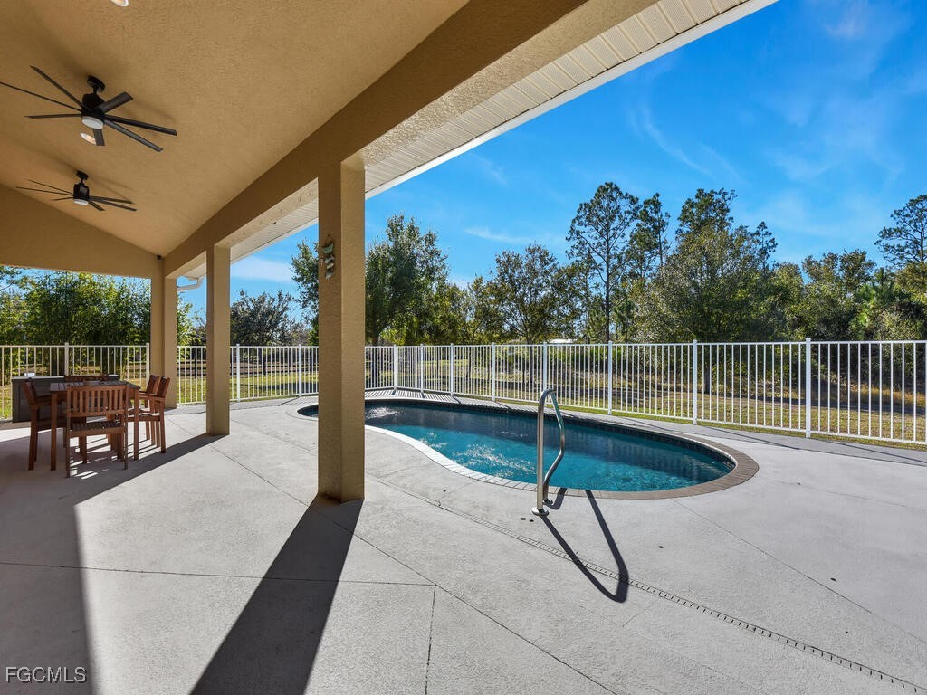 6041 Alan Boulevard Punta Gorda, FL 33982 - Photo 7 of 44 a view of a swimming pool with a couches in a patio