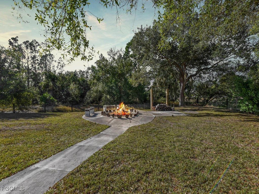 6041 Alan Boulevard Punta Gorda, FL 33982 - Photo 8 of 44 a view of a park with large trees