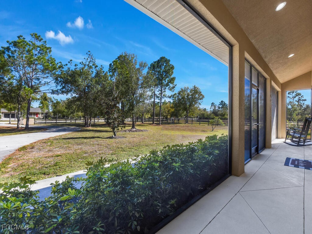 6041 Alan Boulevard Punta Gorda, FL 33982 - Photo 10 of 44 a swimming pool with outdoor seating and yard