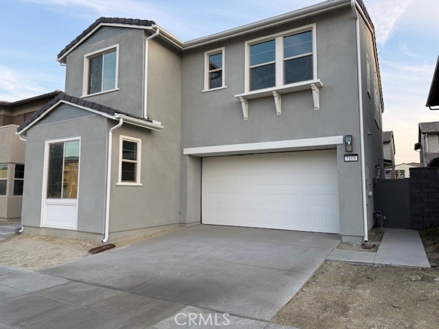 a front view of a house with a garage