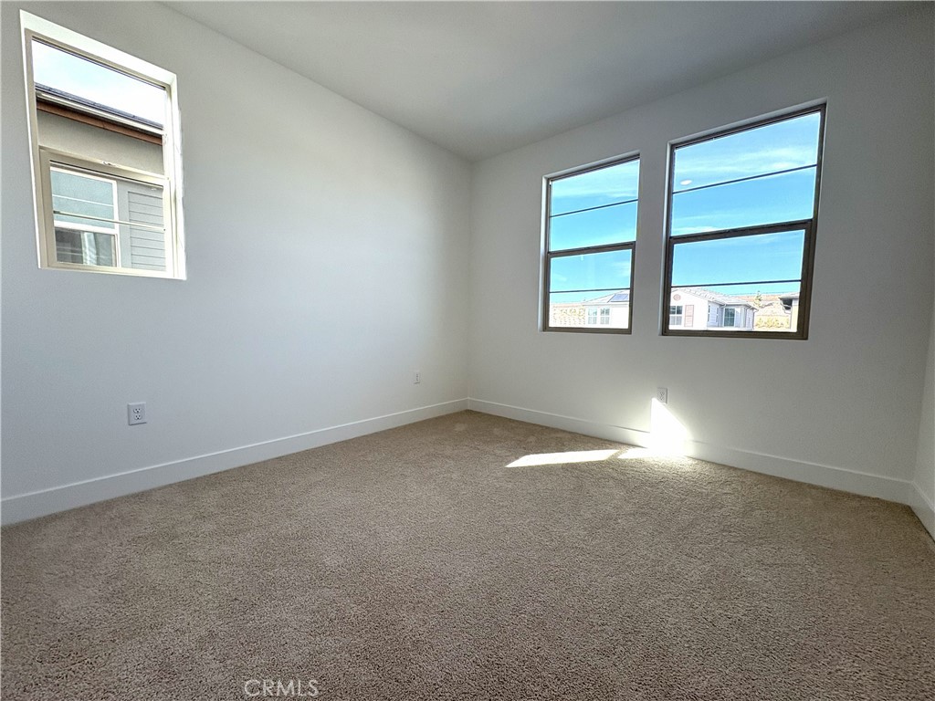 5168 Solace Drive Rancho Mission Viejo, CA 92694 - Photo 12 of 23 an empty room with windows