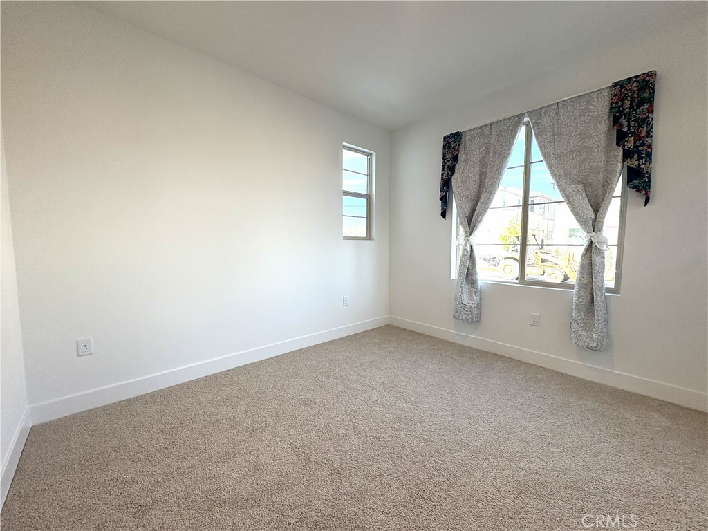 5168 Solace Drive Rancho Mission Viejo, CA 92694 - Photo 13 of 23 an empty room with windows and mirror