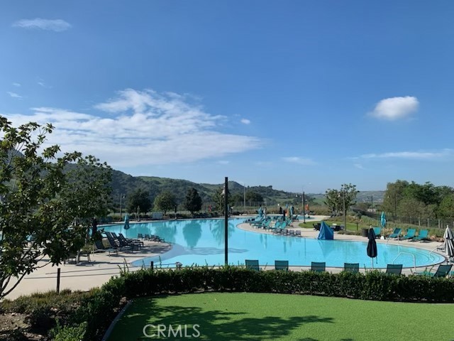 5168 Solace Drive Rancho Mission Viejo, CA 92694 - Photo 20 of 23 a view of a lake with houses in back