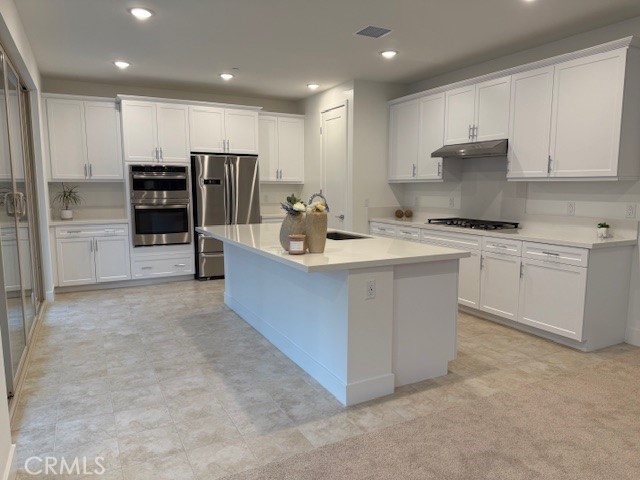 5168 Solace Drive Rancho Mission Viejo, CA 92694 - Photo 3 of 23 a kitchen with stainless steel appliances granite countertop a refrigerator oven a sink and dishwasher