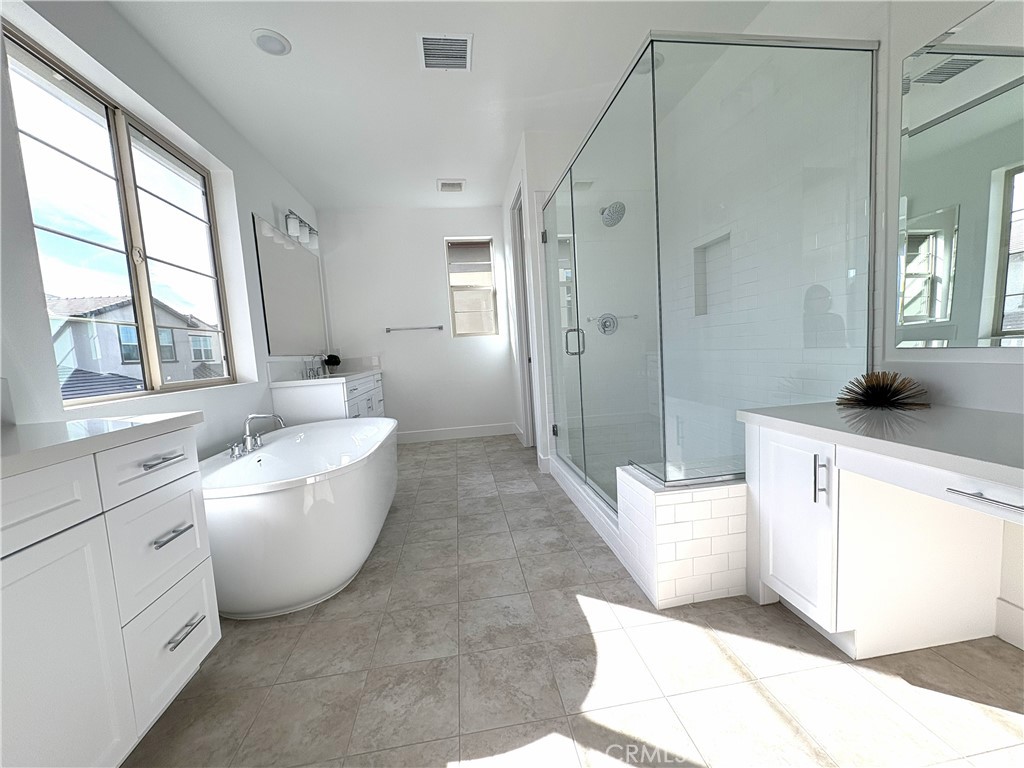 5168 Solace Drive Rancho Mission Viejo, CA 92694 - Photo 7 of 23 a spacious bathroom with a bathtub sink and toilet