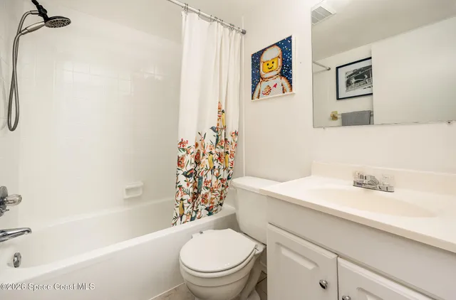 a bathroom with a sink a toilet and a bathtub