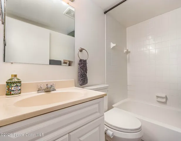 a bathroom with a sink a toilet and a bathtub