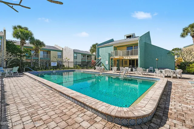 a view of swimming pool with outdoor seating