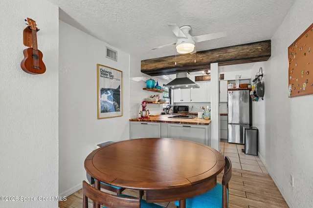 a view of a kitchen with furniture and a chandelier