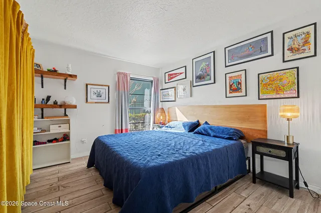 a bedroom with a bed and a table in it