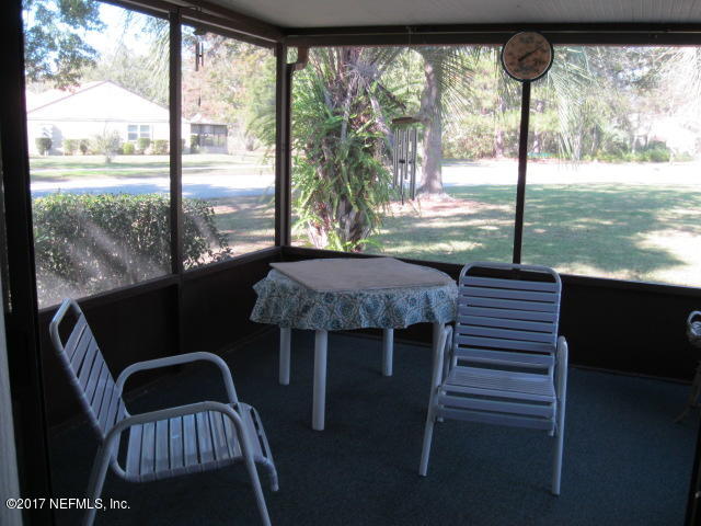 3405 Ricky Court Jacksonville, FL 32223 - Photo 14 of 15 a view of a balcony with a table and chairs