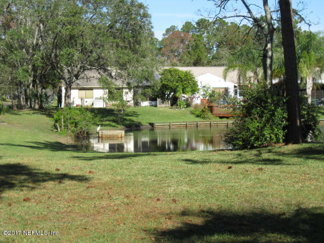 3405 Ricky Court Jacksonville, FL 32223 - Photo 4 of 15 a front view of a house with a yard