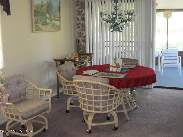 3405 Ricky Court Jacksonville, FL 32223 - Photo 8 of 15 a bedroom with furniture and a window