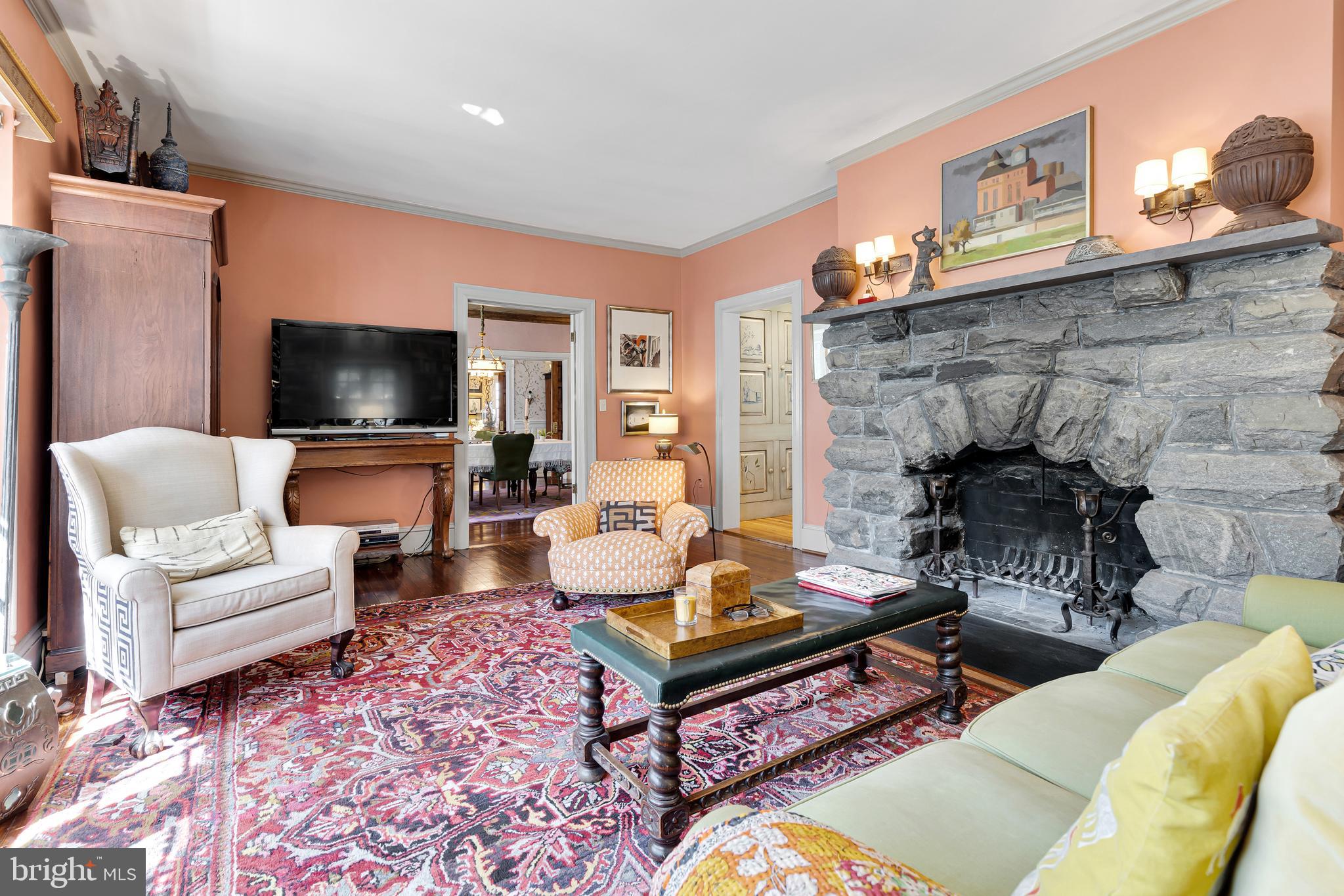 2 Hillside Road Baltimore, MD 21210 - Photo 19 of 79 a living room with furniture a flat screen tv and a fireplace