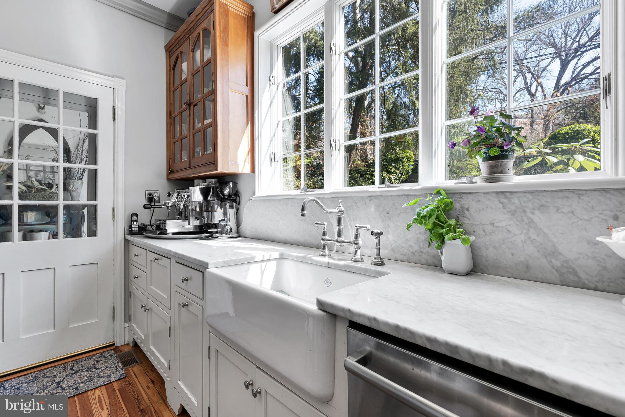 2 Hillside Road Baltimore, MD 21210 - Photo 24 of 79 a kitchen with a granite countertop sink and cabinets