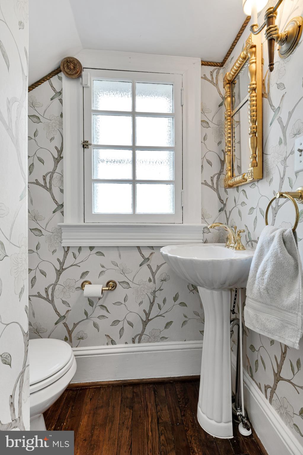 2 Hillside Road Baltimore, MD 21210 - Photo 29 of 79 a bathroom with a sink a toilet and a window