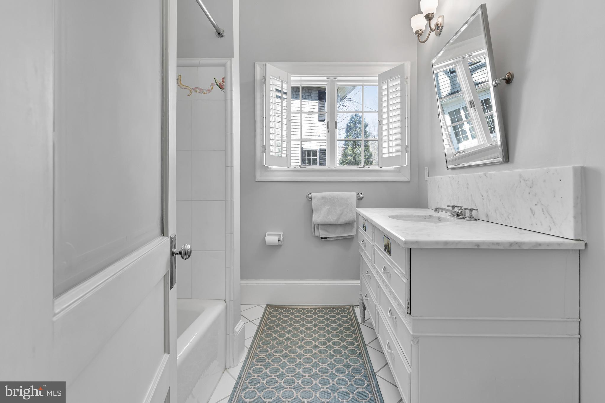 2 Hillside Road Baltimore, MD 21210 - Photo 54 of 79 a bathroom with a sink a toilet and a bathtub