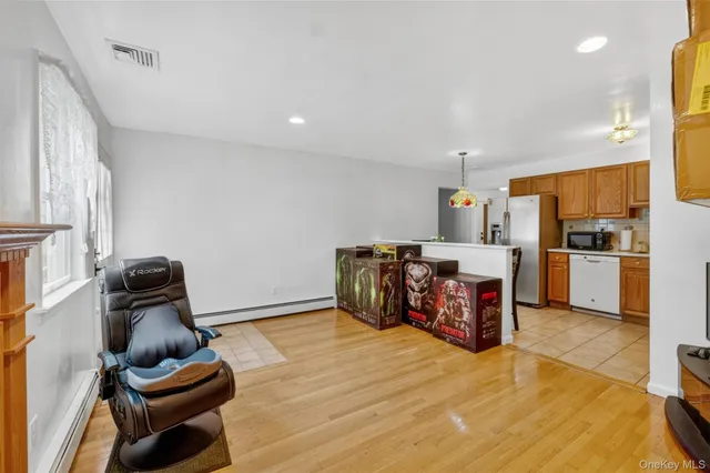 a bedroom with furniture and wooden floor
