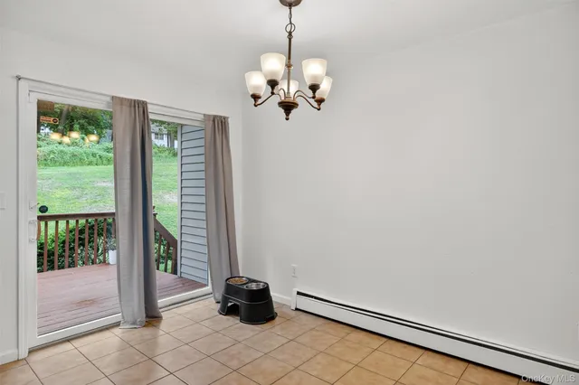 a view of a chandelier in a room with a window