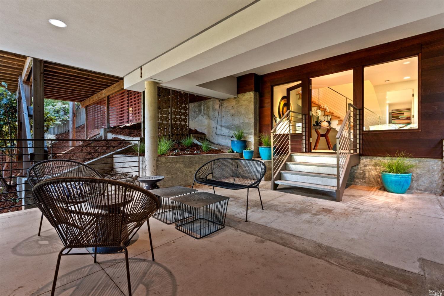655 Edgewood Avenue Mill Valley, CA 94941 - Photo 11 of 85 a living room with furniture and a floor to ceiling window