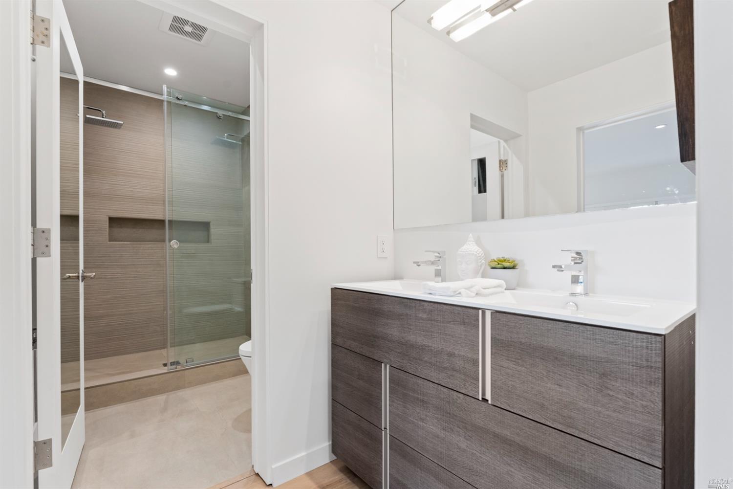 655 Edgewood Avenue Mill Valley, CA 94941 - Photo 23 of 85 a bathroom with a shower sink vanity and mirror